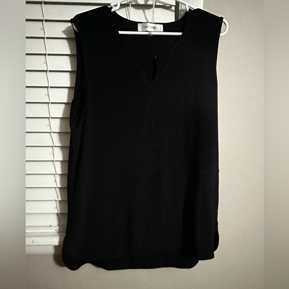 NWOT black blouse with small open slit in back